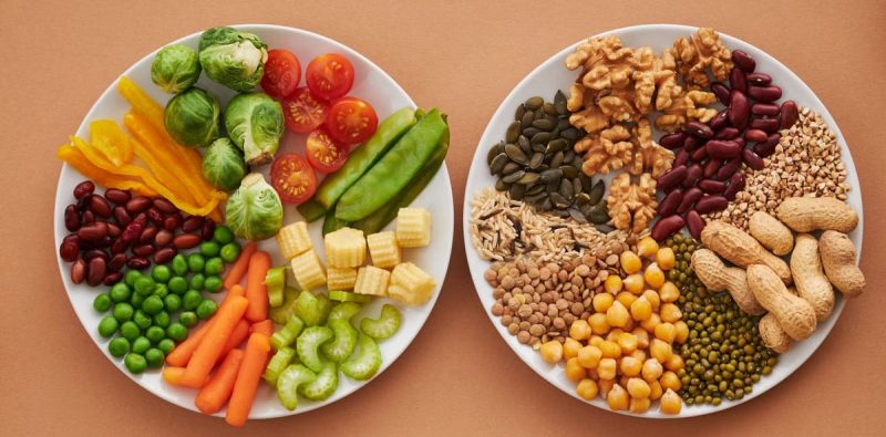 A vibrant flatlay of colorful vegetables and nuts showcasing a balanced diet concept.